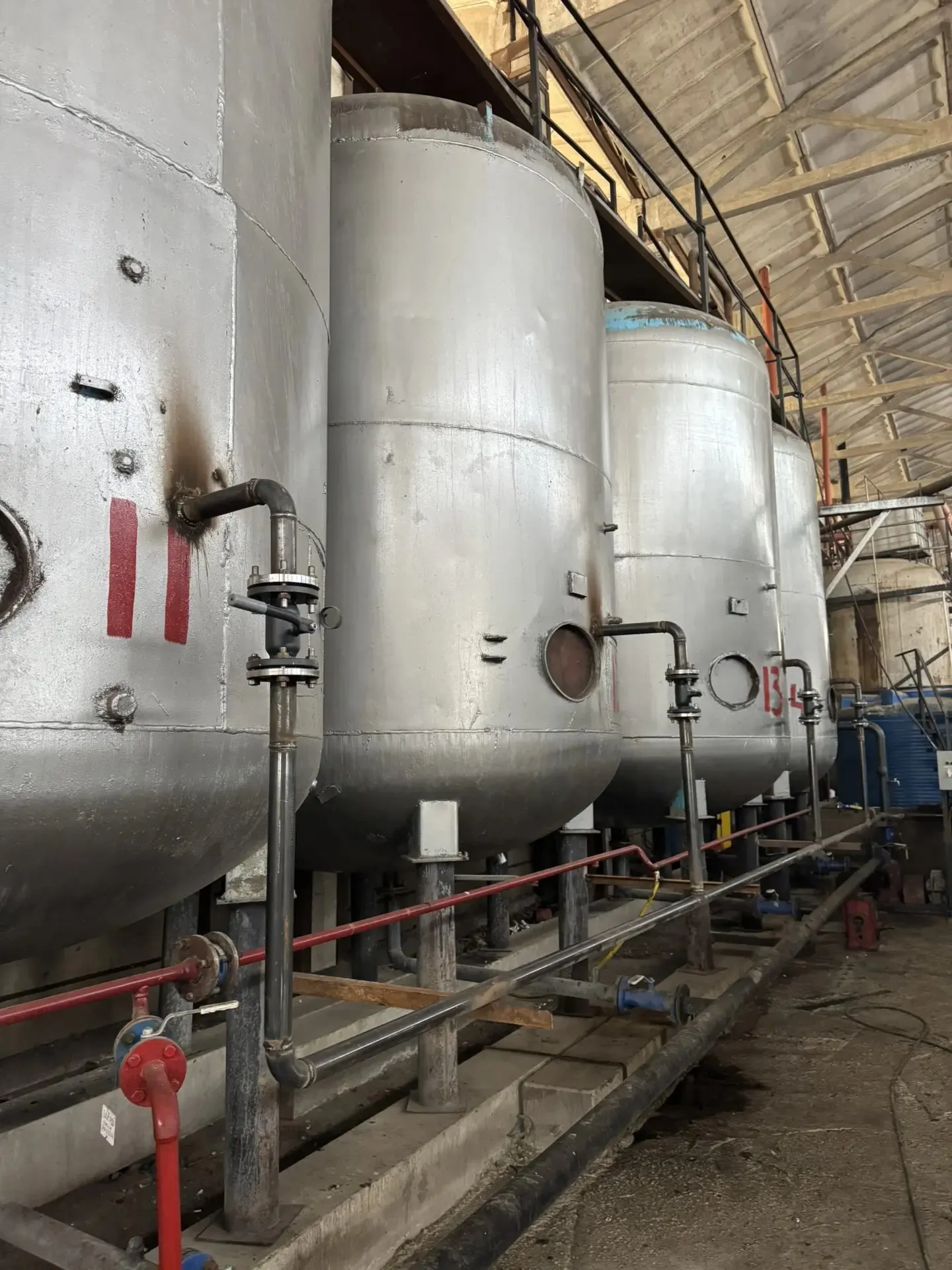 Vertical processing vessels and pipework